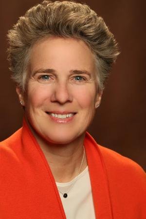 A smiling woman looking into the camera