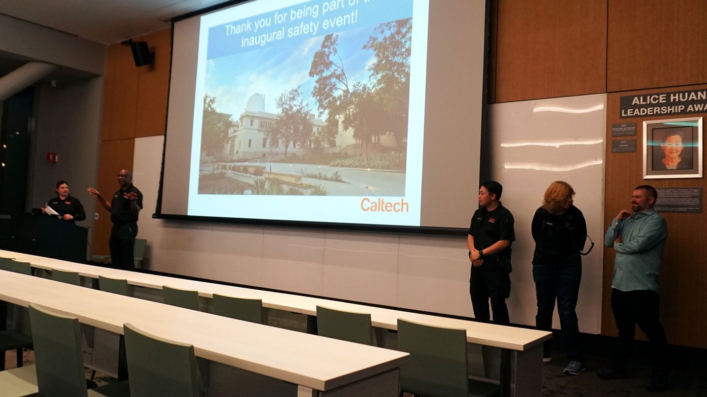 Hampton Cantrell (second from left) and Caltech security officers prepare attendees for the night walk.