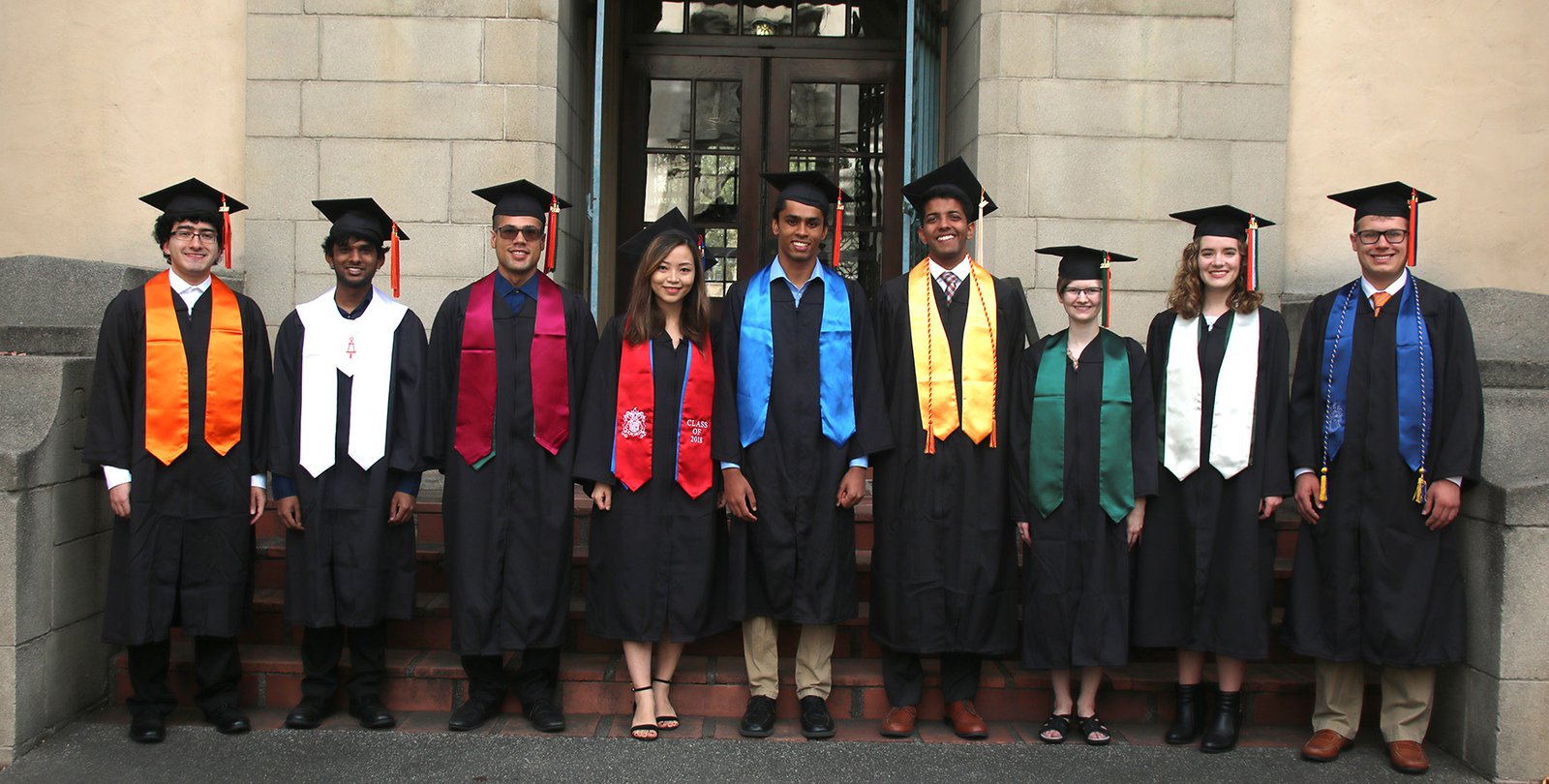 Photo showing the different types of academic regalia worn by graduating Caltech students.