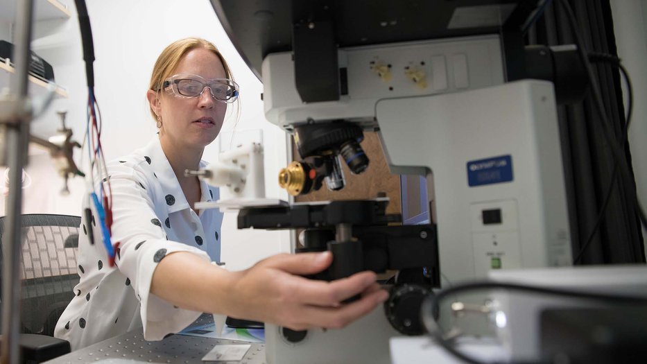 caltech professor working with chemistry lab equipment