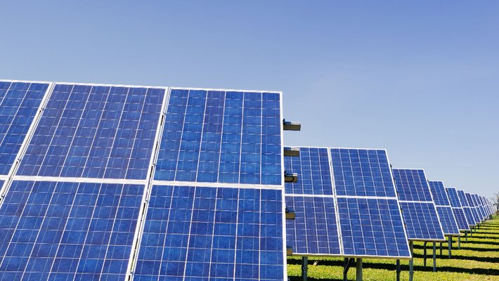 Solar panels in a grassy field