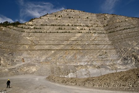 A pyramid shaped rocky cut into the ground