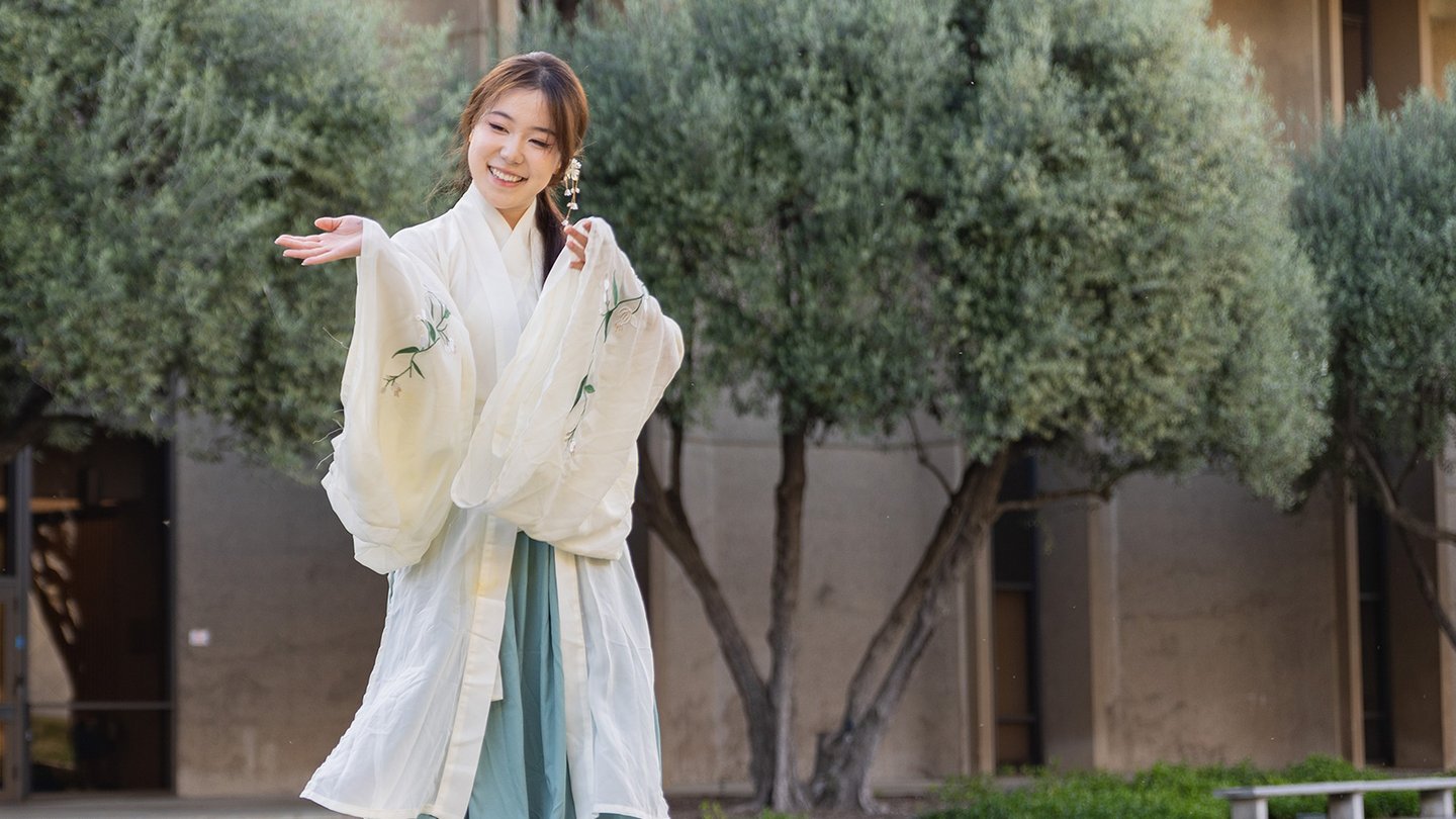 Undergraduate Gabo Zhang models a traditional Chinese outfit in the fashion show.
