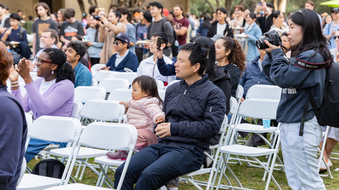 Attendees watch and cheer on performers in the multicultural talent and fashion show.